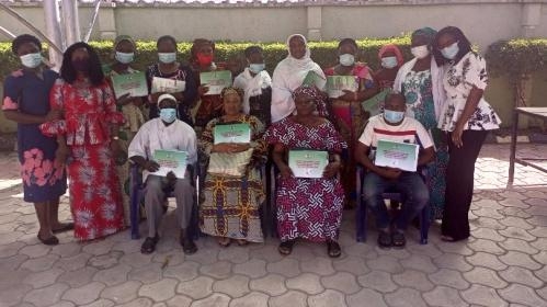 Trained Health Care Providers in Gwagalada displaying Job-Aids on AYFHS