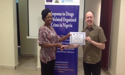 WFI Staff receives certification from UNODC Consultant to implement the DPTC Sensitization Modules.